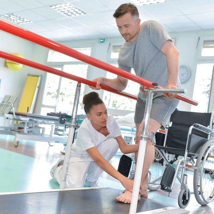 Physiotherapist working on post injury rehab on knee surgary
