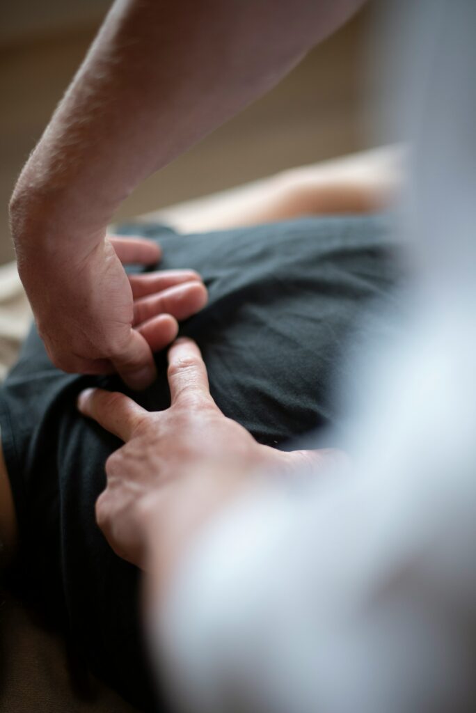 Physiotherapist assisting a patient with hand therapy